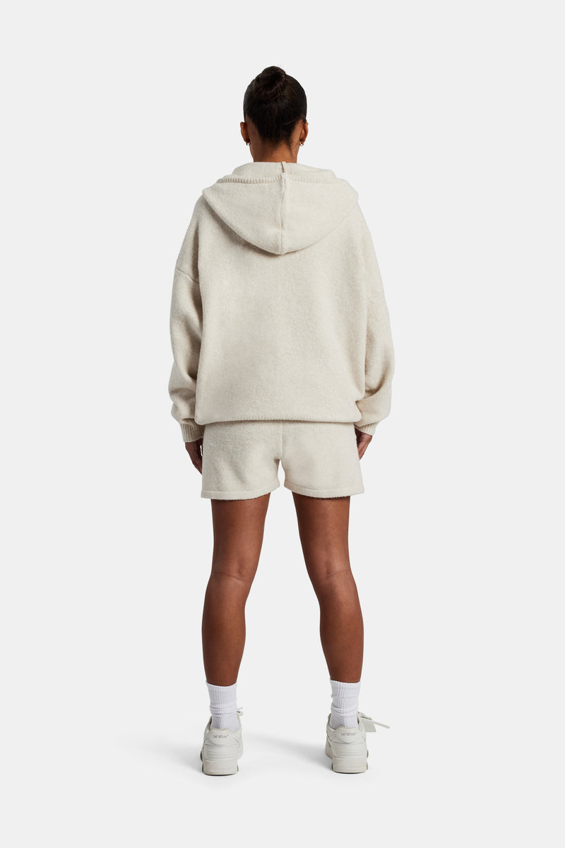 female model wearing the Hooded Zip Through Knitted Short Tracksuit in oatmeal