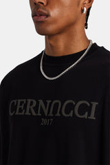 male model wearing Tonal logo oversized t-shirt in black