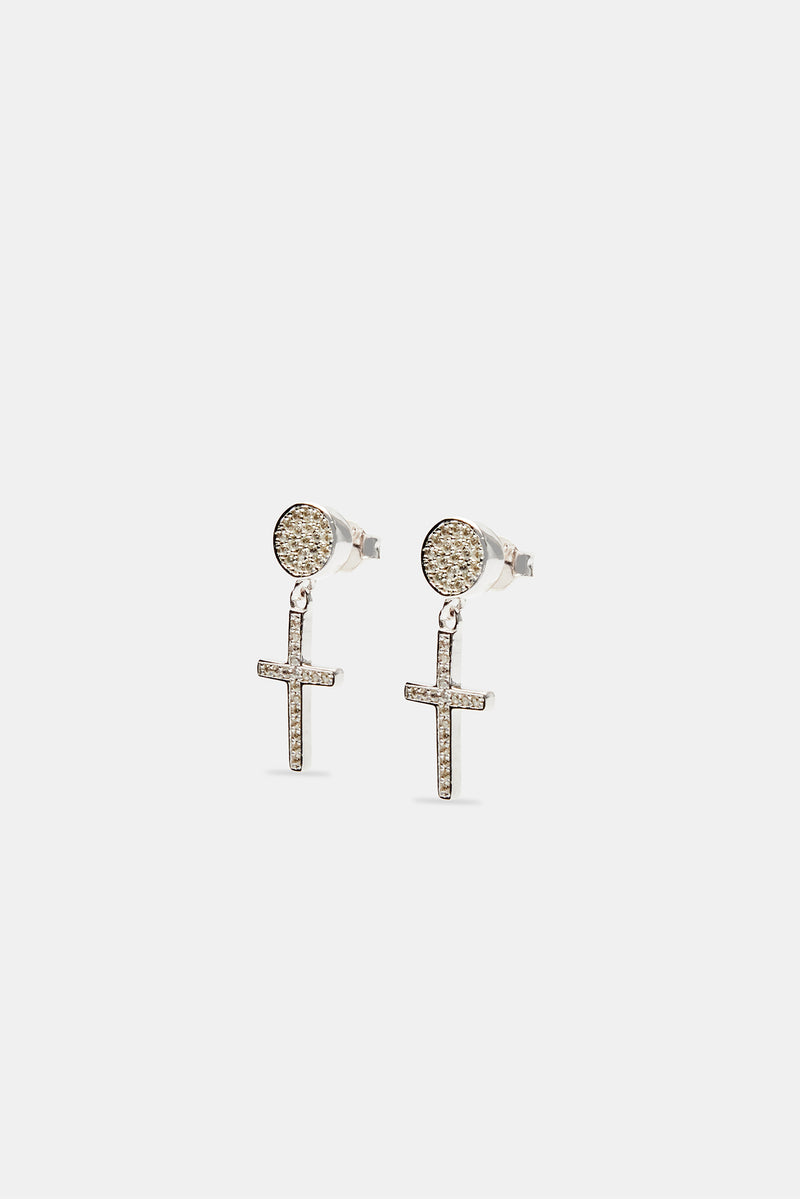 Iced cross drop stud earrings on white background