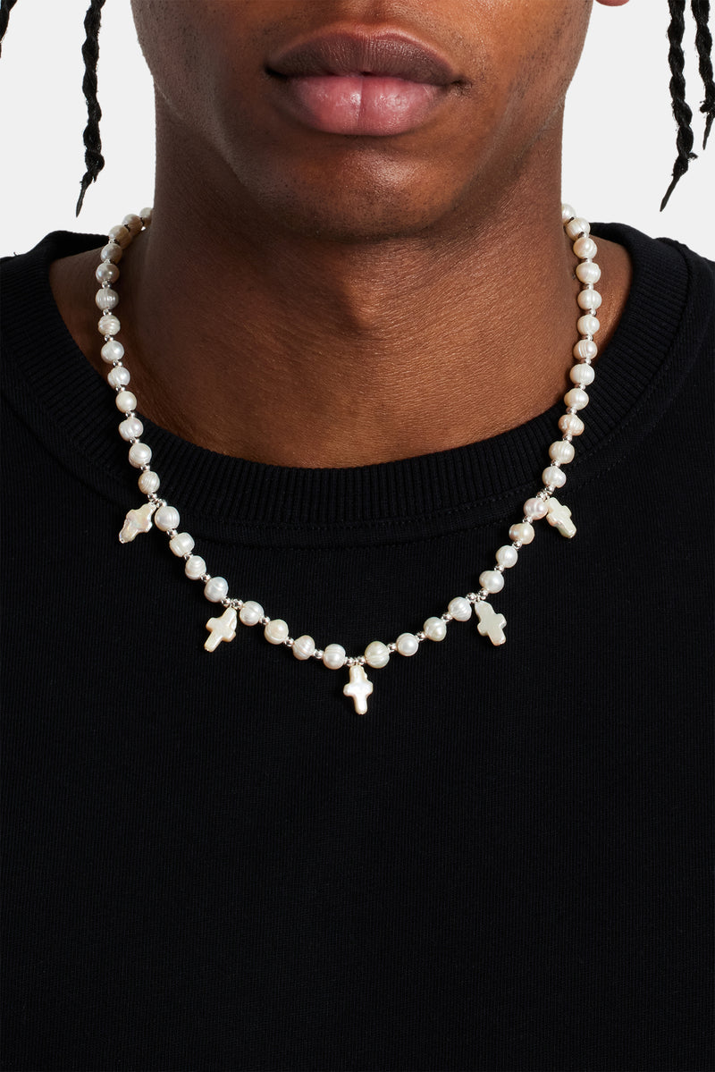 Male model wearing the freshwater pearl cross necklace